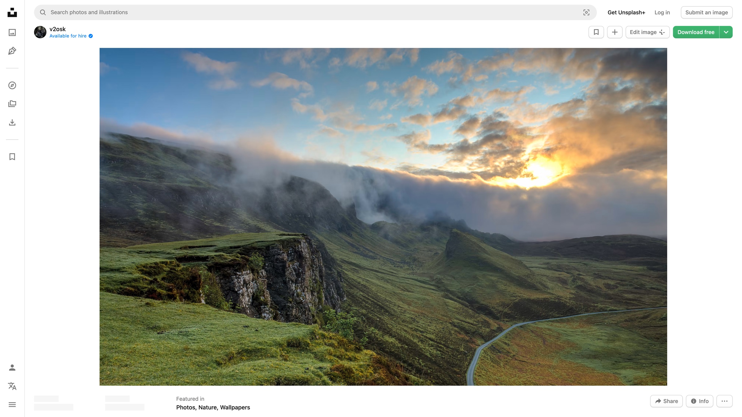 An Unsplash photo page showing the Download free button and photographer credit while logged out